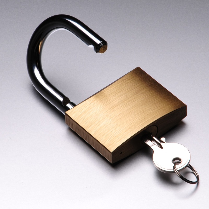 Open padlock with a key inserted